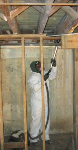 Professional vacuuming mold in basement after sheetrock removal