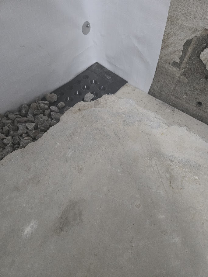 Drainage line with gravel and concrete installation