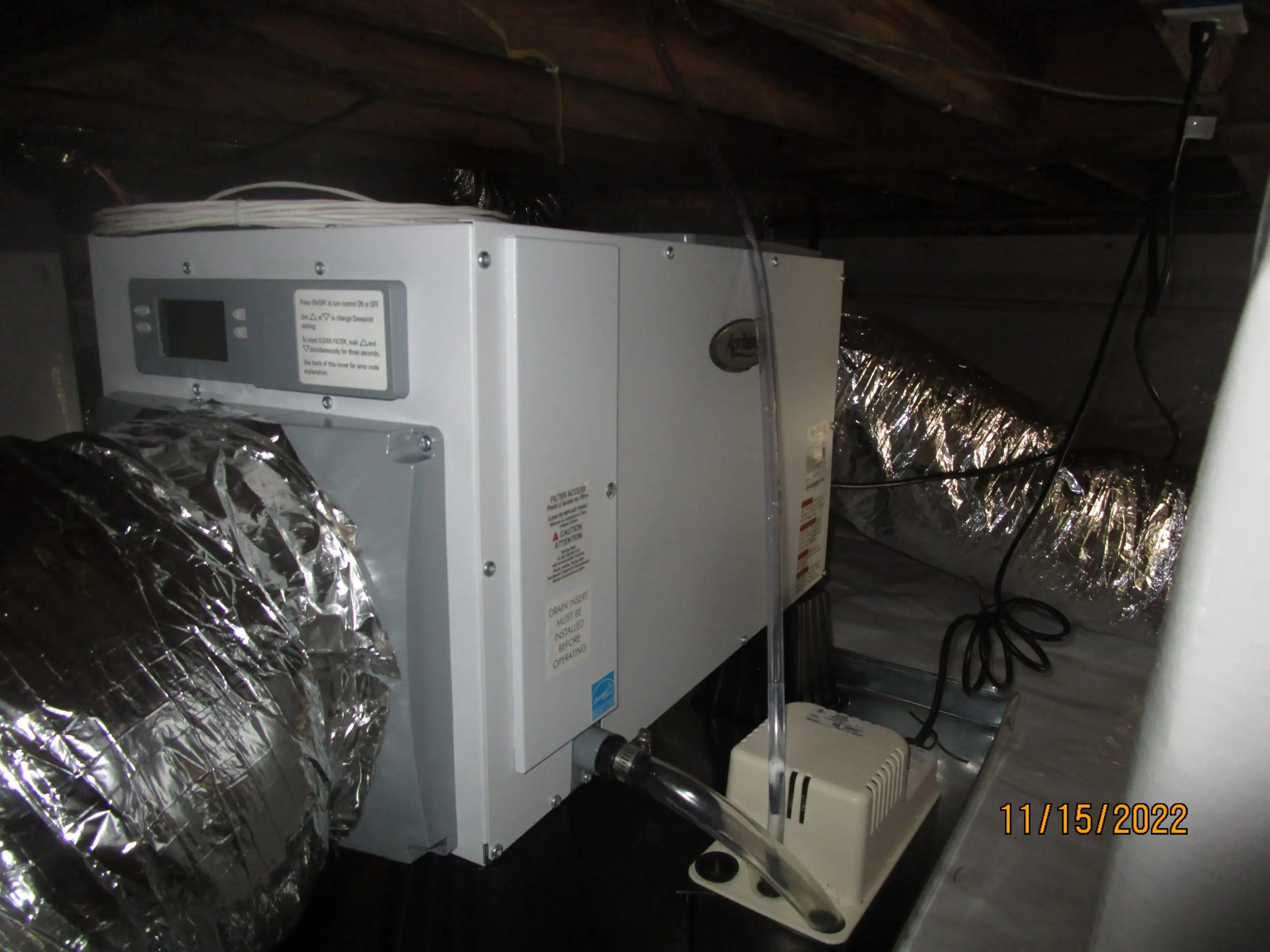 Crawl space dehumidifier and ductwork for moisture control