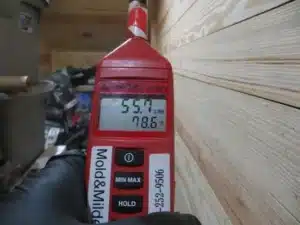 Checking temperature and humidity in a basement with a hygrometer